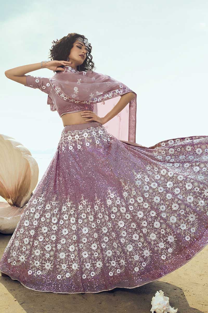 0099064 exotic lilac colored partywear embroidered net lehenga choli